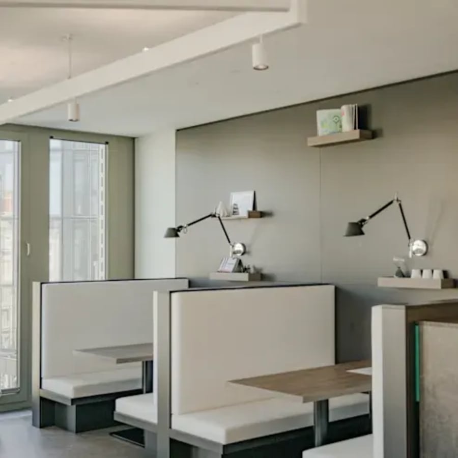 Modern coworking space in Kondapur with stylish booths and ample natural light.