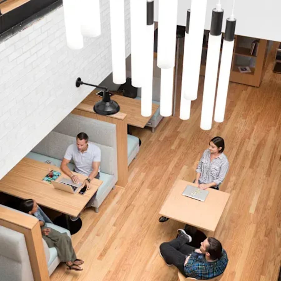 Bright coworking area with modern seating and ample lighting in Hyderabad. Perfect for collaboration.