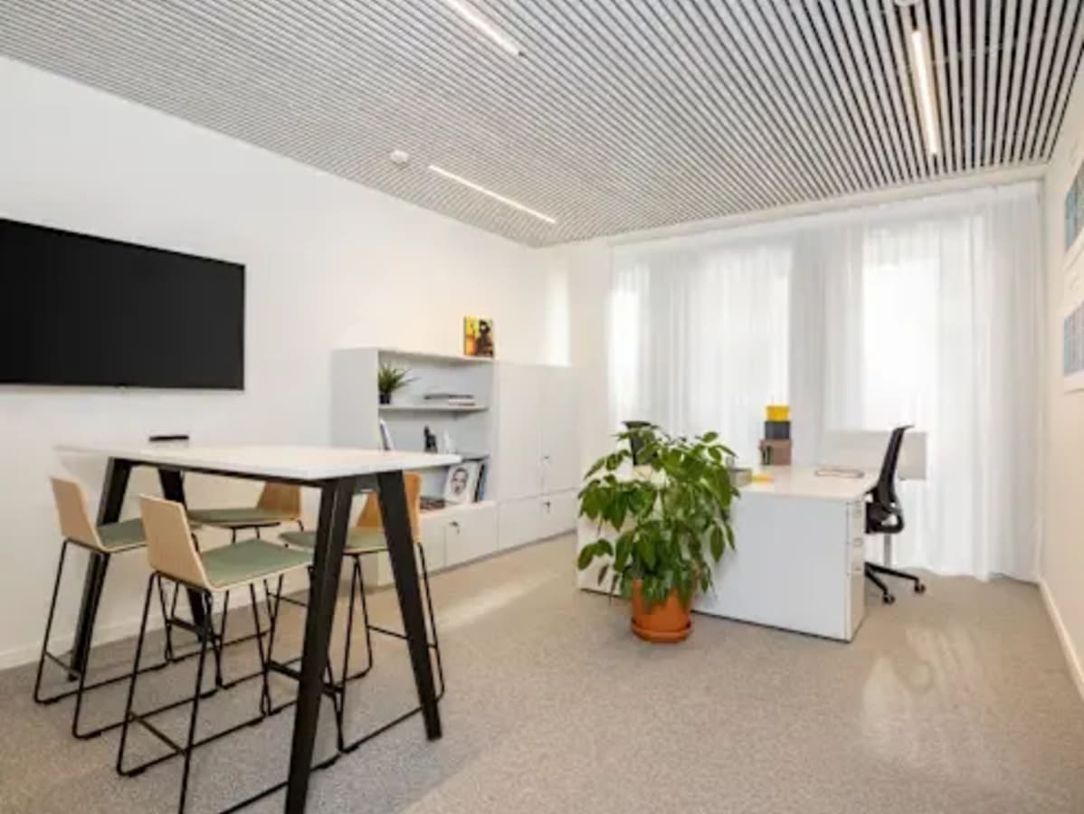 Bright coworking space in Zirakpur featuring modern furniture and abundant natural light.