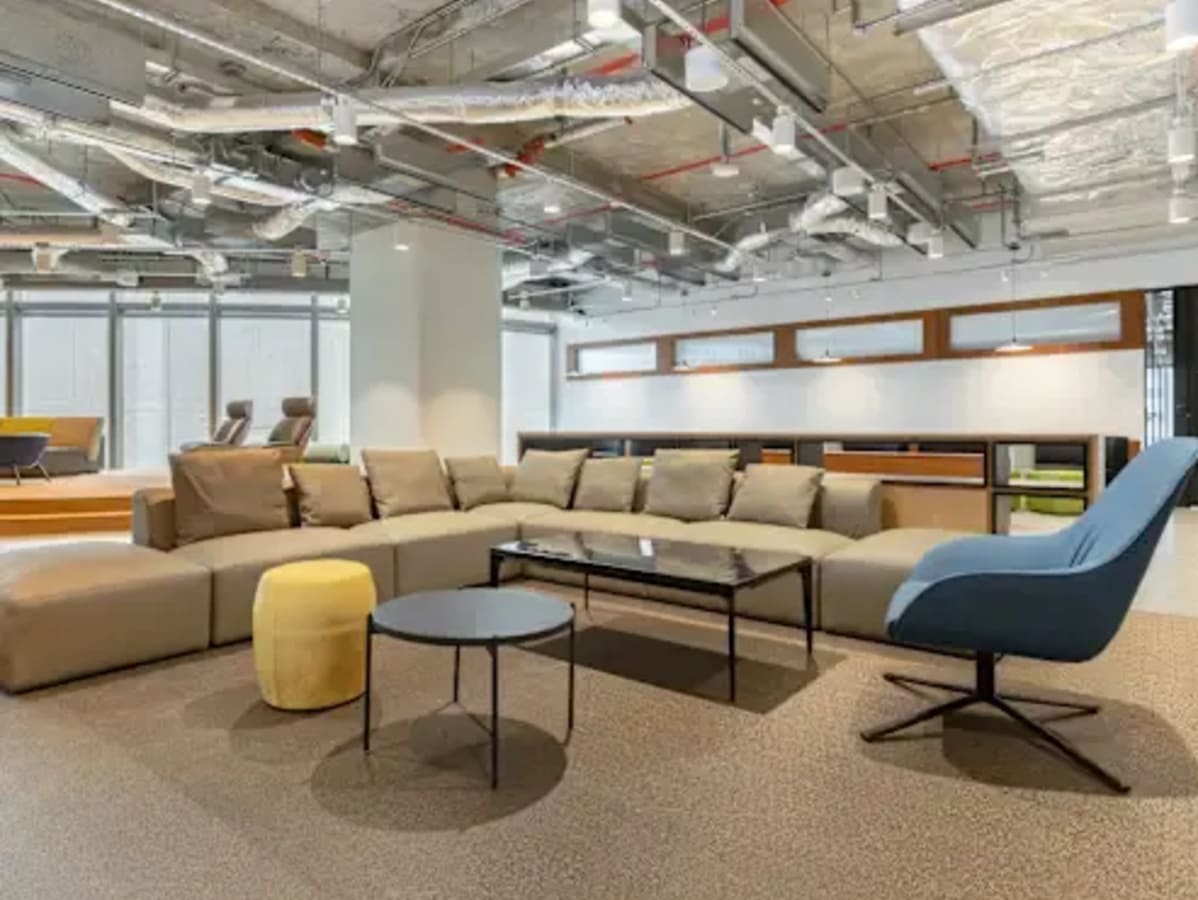 Modern coworking space in Zirakpur with cozy seating and stylish decor. Ideal for collaboration.