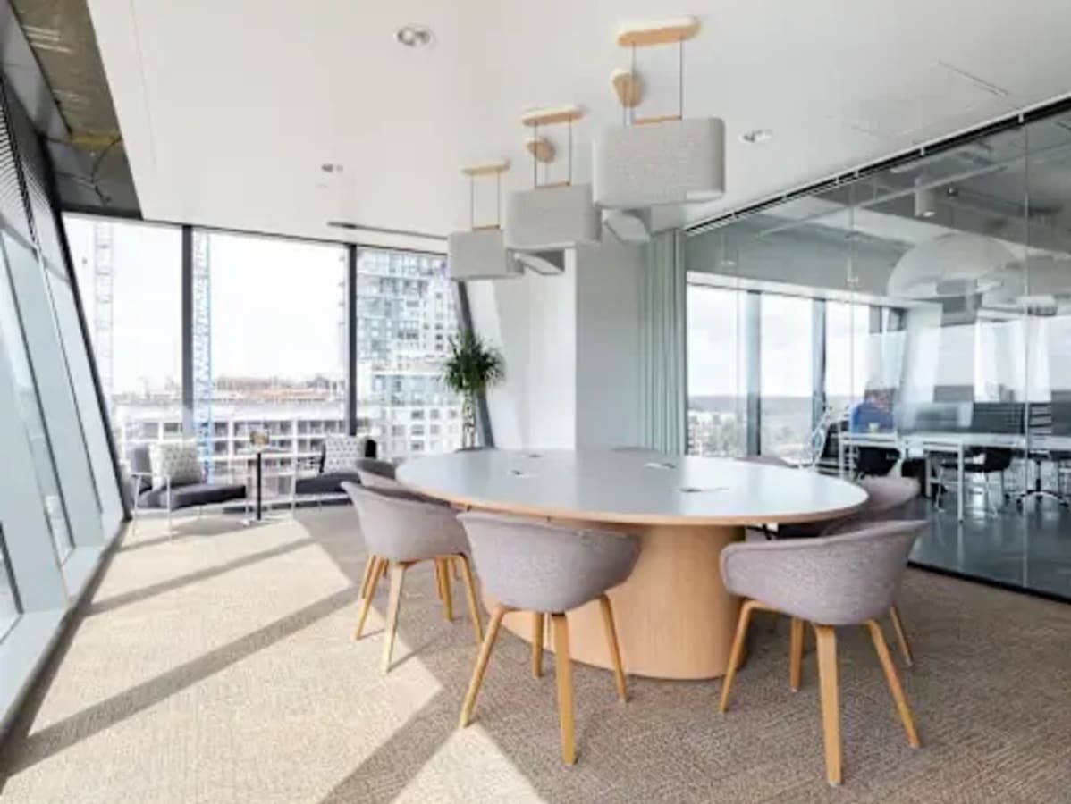 Modern coworking space in Zirakpur with spacious seating, natural light, and a sleek meeting area.