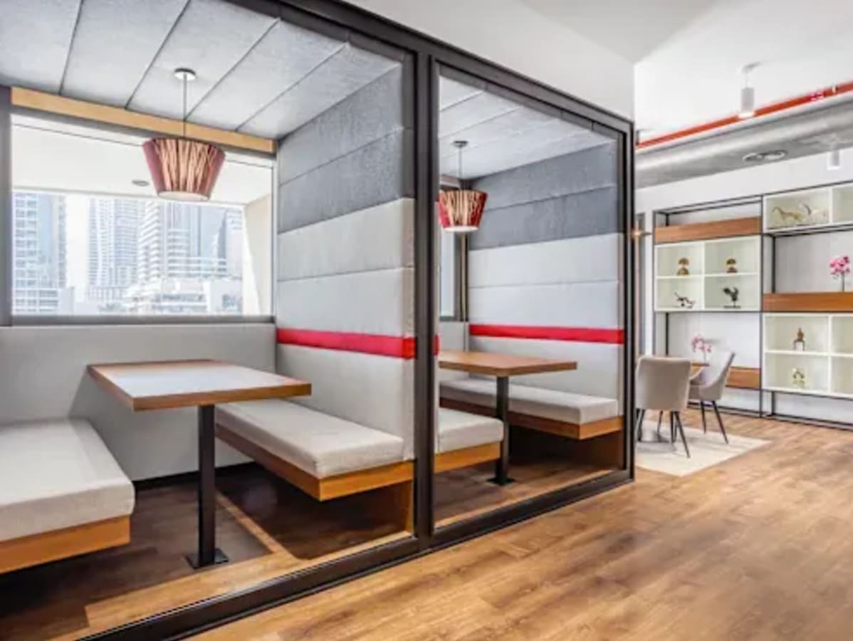 Modern coworking space in Zirakpur with cozy booths and elegant meeting areas.