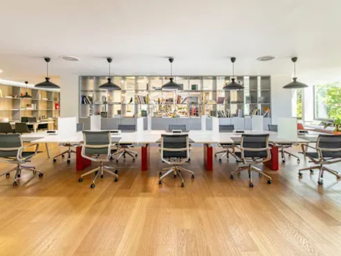 Spacious coworking area in Zirakpur with modern desks, ergonomic chairs, and ample natural light.