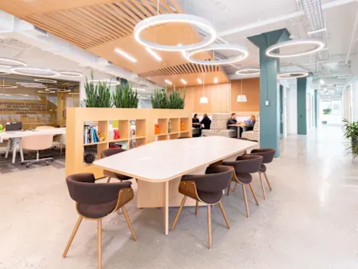 Modern coworking space with natural light, sleek design, and collaborative seating on Outer Ring Road.