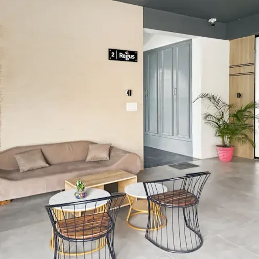Modern coworking space with stylish seating and natural light on Sahastradhara Road.