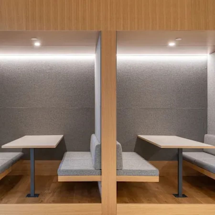 Cozy booths for focused work, featuring modern design and ambient lighting in Ambli-Bopal Road.