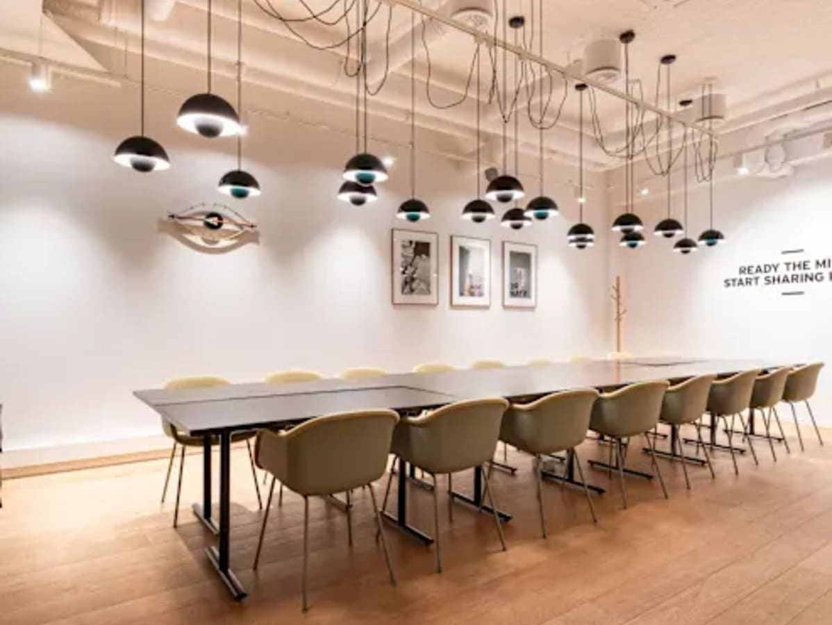 Modern coworking area with sleek lighting and ample seating in Kondapur. Ideal for collaboration.