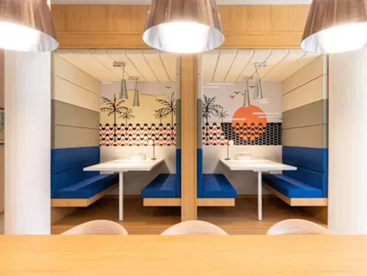 Bright and modern coworking booths with vibrant decor in Kondapur's flexible office space.