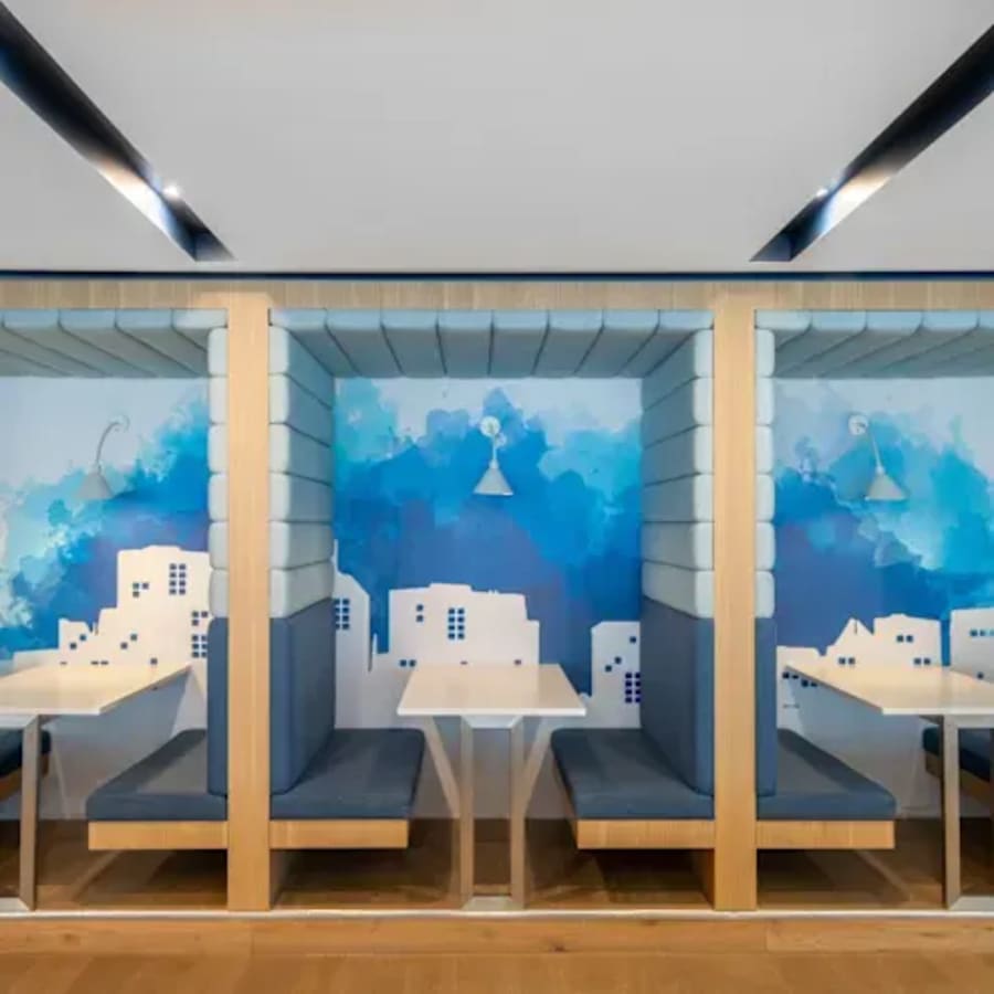 Vibrant, private work pods with artistic wall design in a flexible coworking space on Lazer Street.
