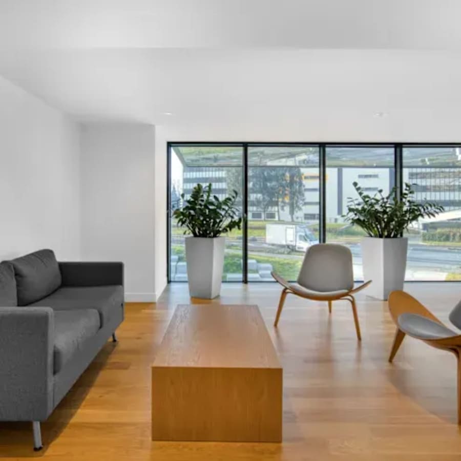 Modern coworking space with sleek seating, natural light, and serene views in Civil Lines.
