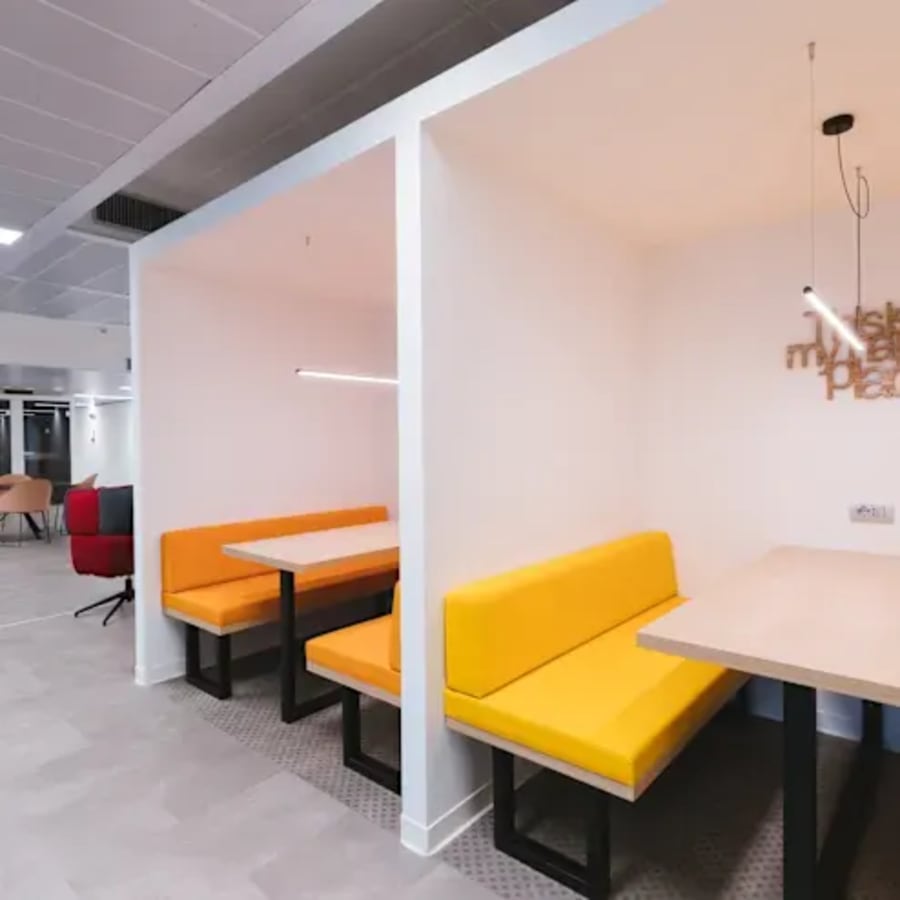 Vibrant booths offer a stylish, collaborative workspace in Amritsar. Perfect for teamwork.