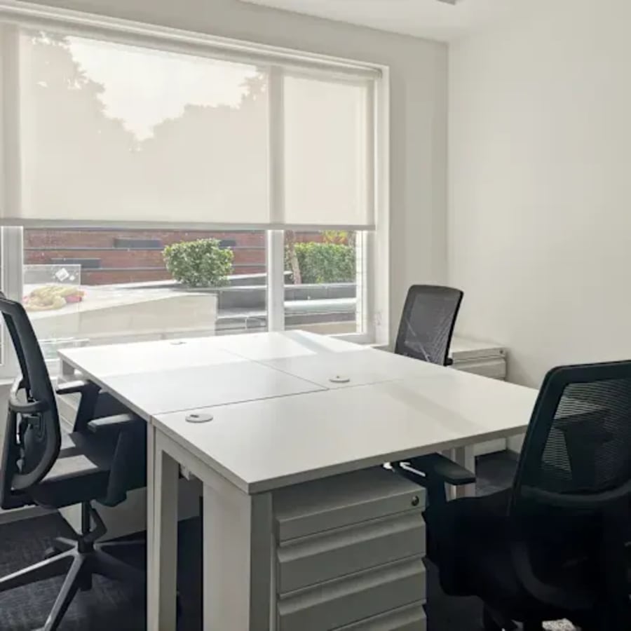 Bright workspace with modern chairs, natural light, and ergonomic desks in Chandigarh's Sector 26.
