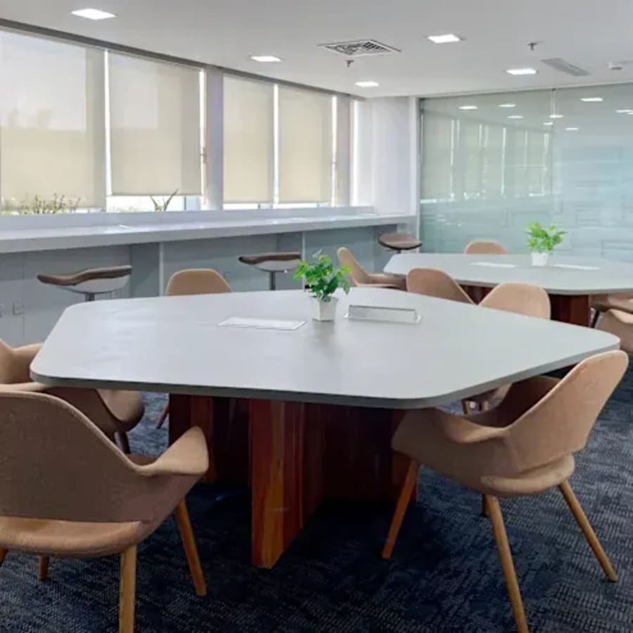 Modern coworking area with ample natural light and stylish seating in Sector 49, Haryana.