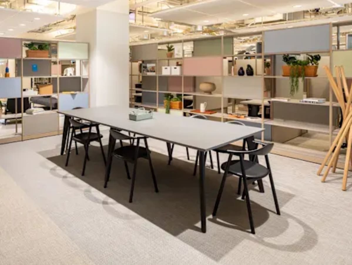 Modern coworking space with ample natural light and stylish furnishings on Golf Course Extension Road.