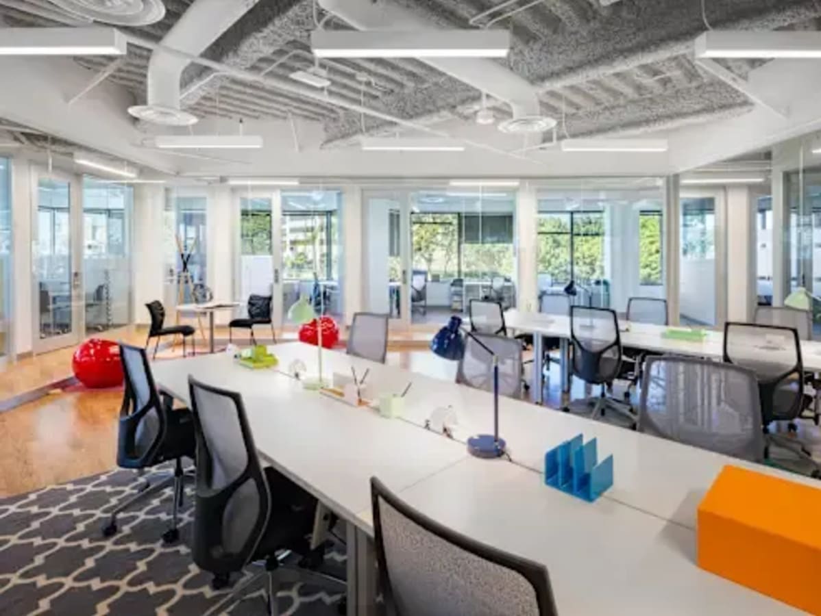 Bright coworking space in Civil Lines features modern design, open layout, and natural light.