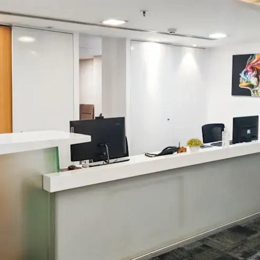 Modern coworking space in Jaipur with sleek reception and vibrant artwork.