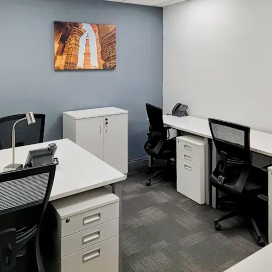 Modern coworking space with ergonomic chairs, ample storage, and natural lighting.