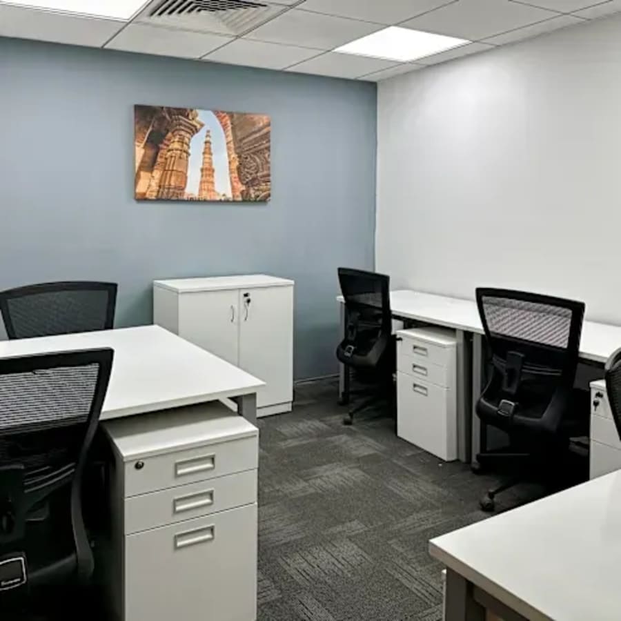 Modern coworking space with ergonomic chairs and ample natural light in Gomti Nagar.