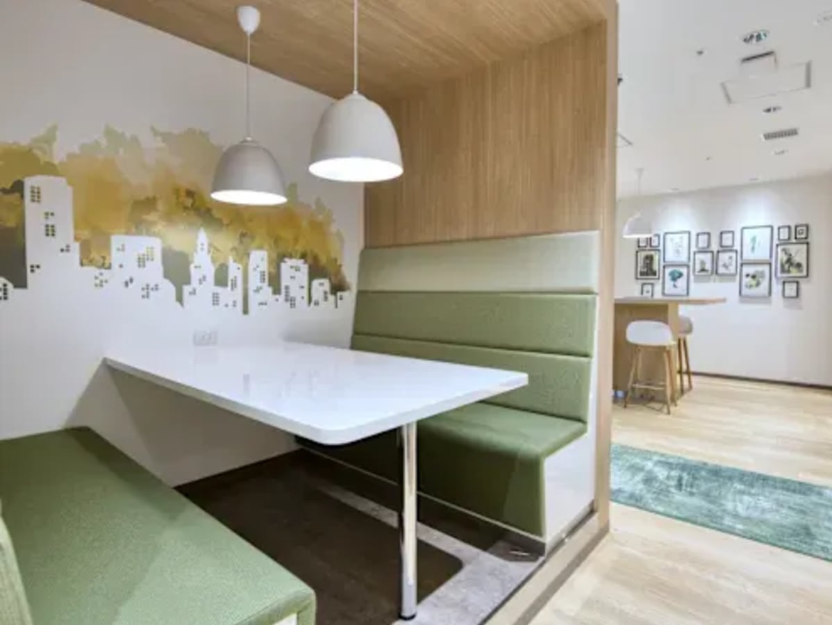 Chic coworking nook with modern decor and cozy seating in vibrant Khlong Toei.