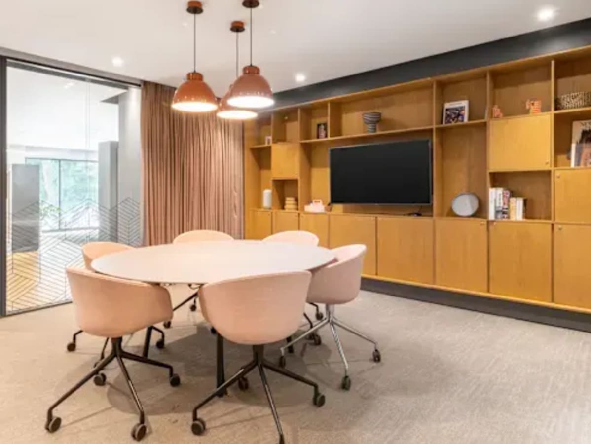 Modern coworking space with stylish seating, ample storage, and natural light in Electronic City.