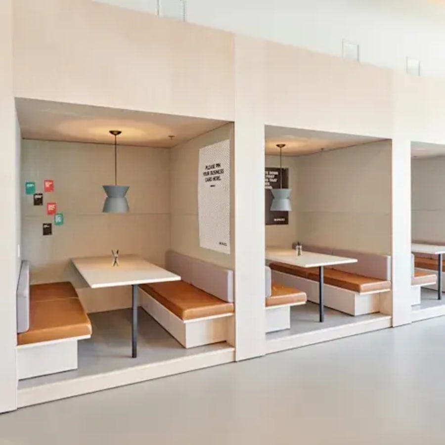 Modern coworking nooks with cozy seating, ideal for collaboration in Kozhikode Bypass.