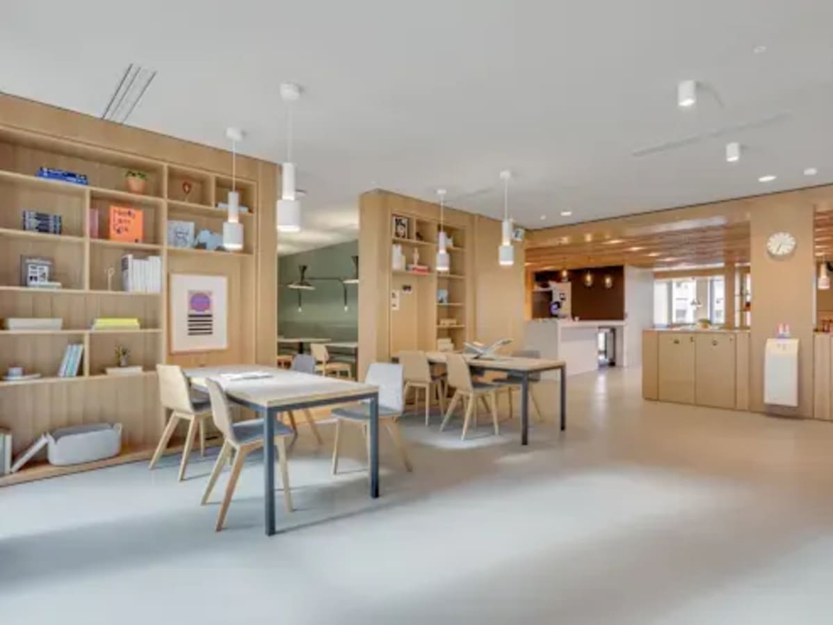 Bright, open coworking space with modern furniture and ample natural light in Kozhikode Bypass.