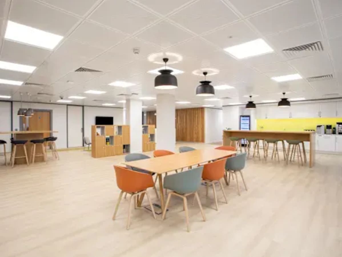 Bright coworking space in Rajiv Gandhi Salai, featuring modern furnishings and ample natural light.