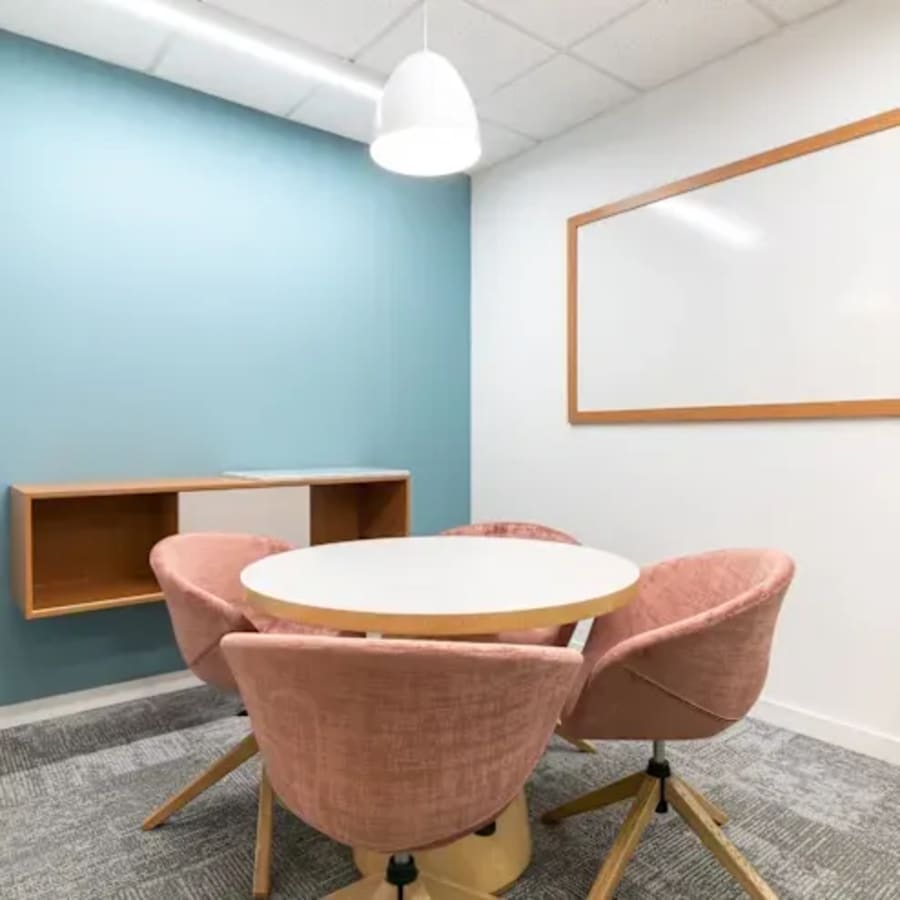 Modern coworking space with stylish seating and a vibrant, collaborative atmosphere.