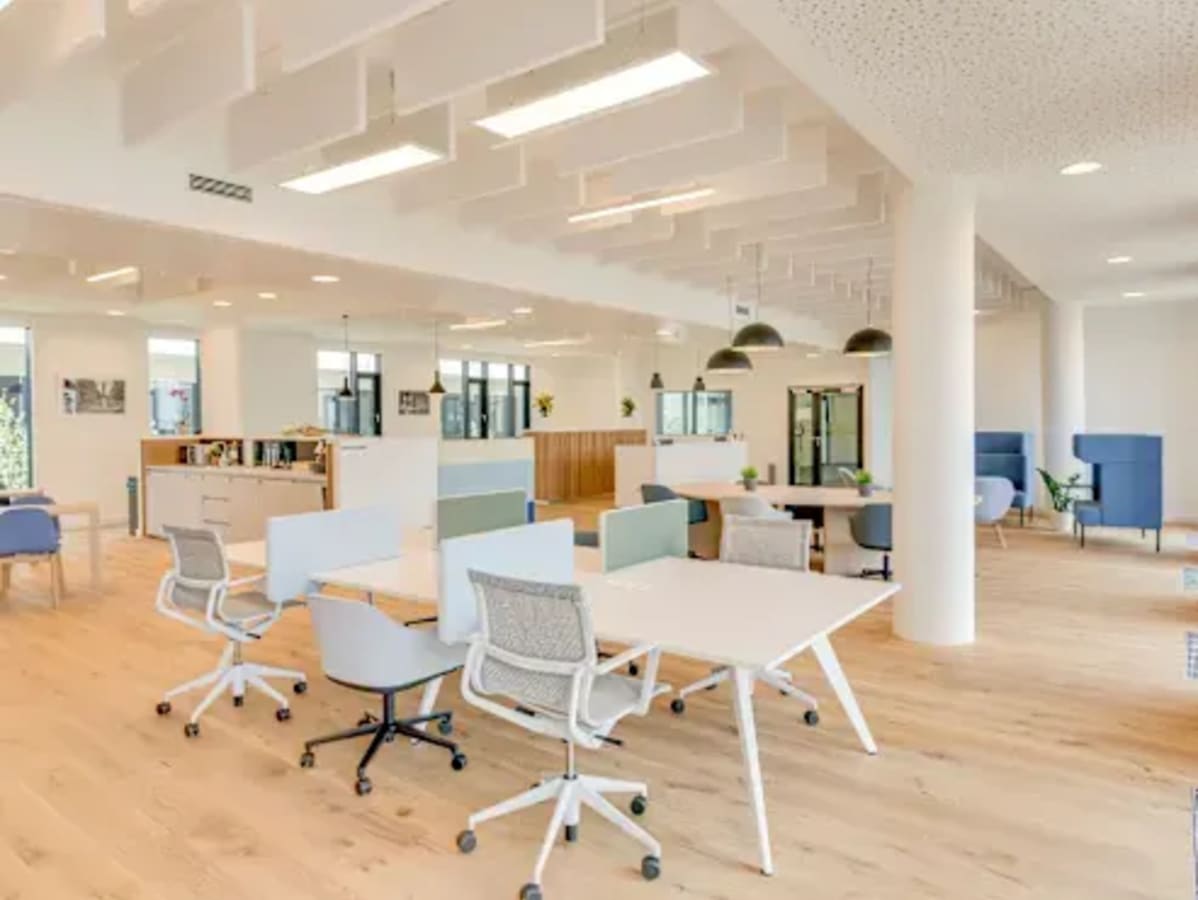 Bright, open coworking space with modern furniture and ample natural light on Grand Trunk Road.
