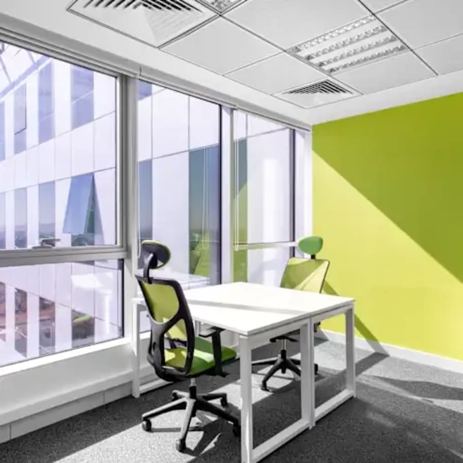 Bright, modern coworking space with natural light and vibrant accents in Aurangabad.