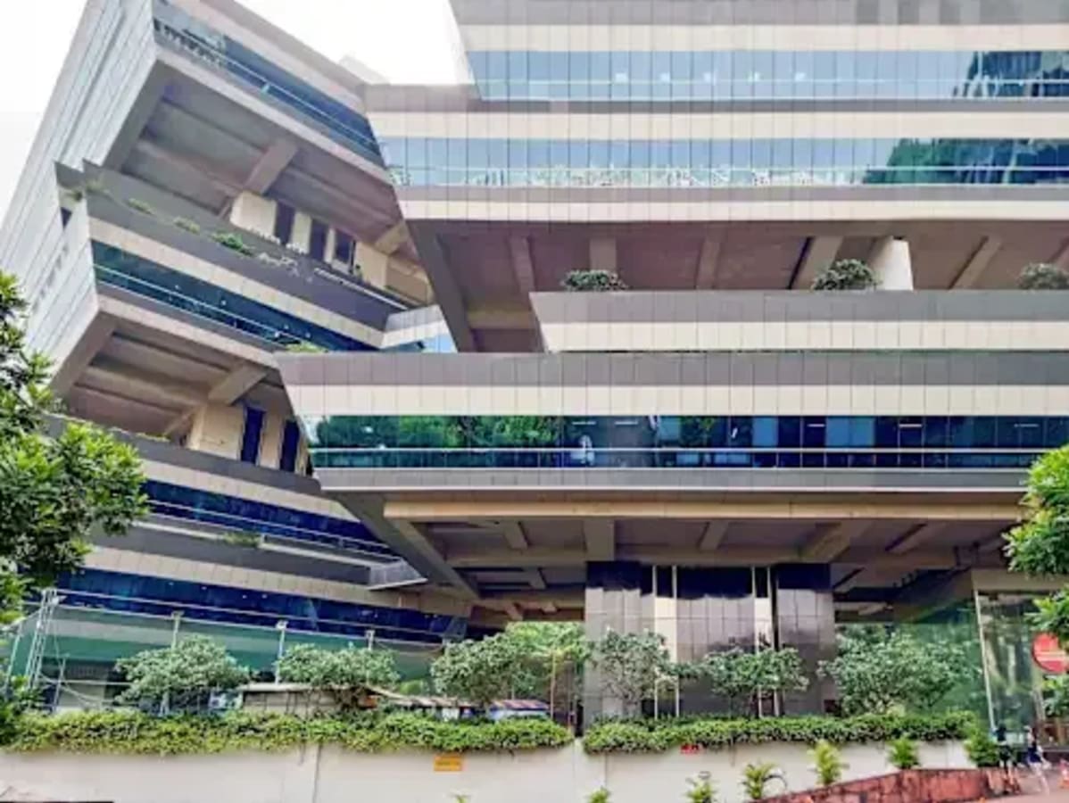 Modern coworking space in Powai featuring innovative architecture and lush greenery.