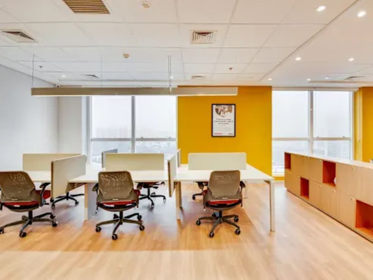 Bright coworking space with modern workstations and ample natural light in Vadodara.