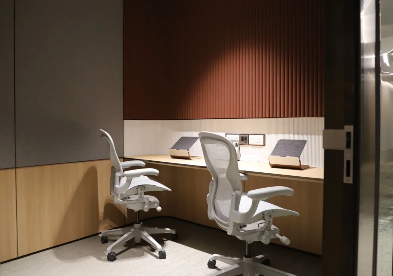 Modern coworking space with ergonomic chairs and sleek workstations in Church Street, Singapore.