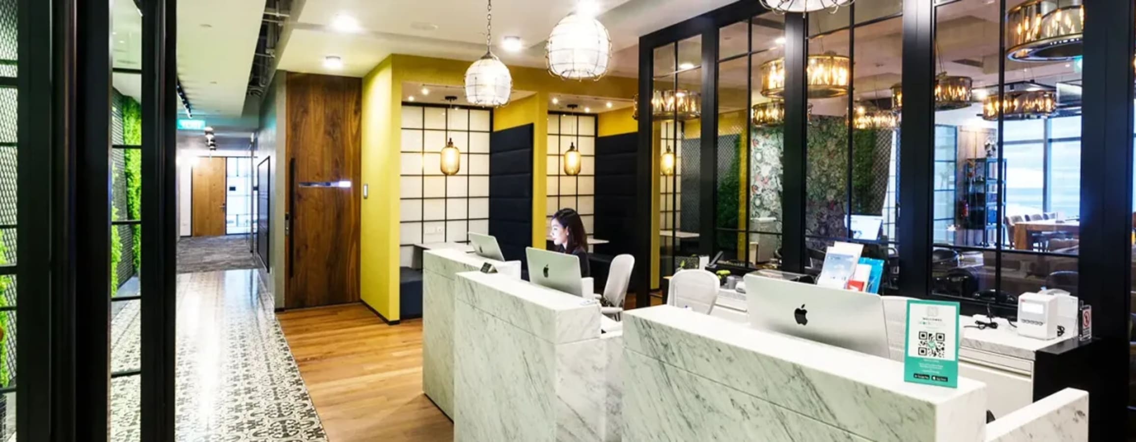 Sophisticated coworking space with marble counters, sleek design, and modern lighting in Cecil Street.