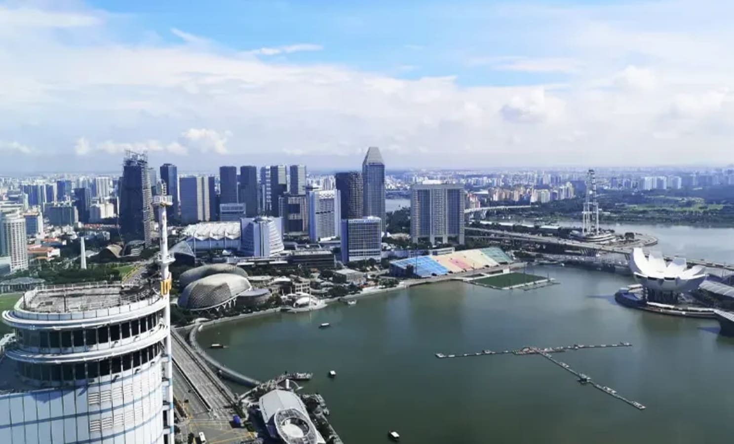 Stunning cityscape views from a flexible coworking space in Collyer Quay, Singapore.