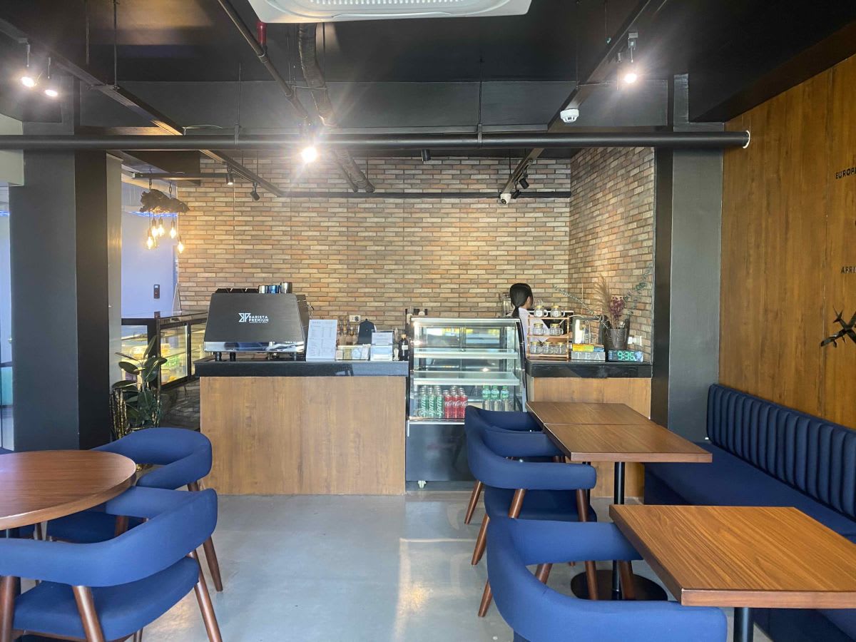 Chic coworking space with modern café, perfect for networking and meetings in Angel St, Central Luzon.