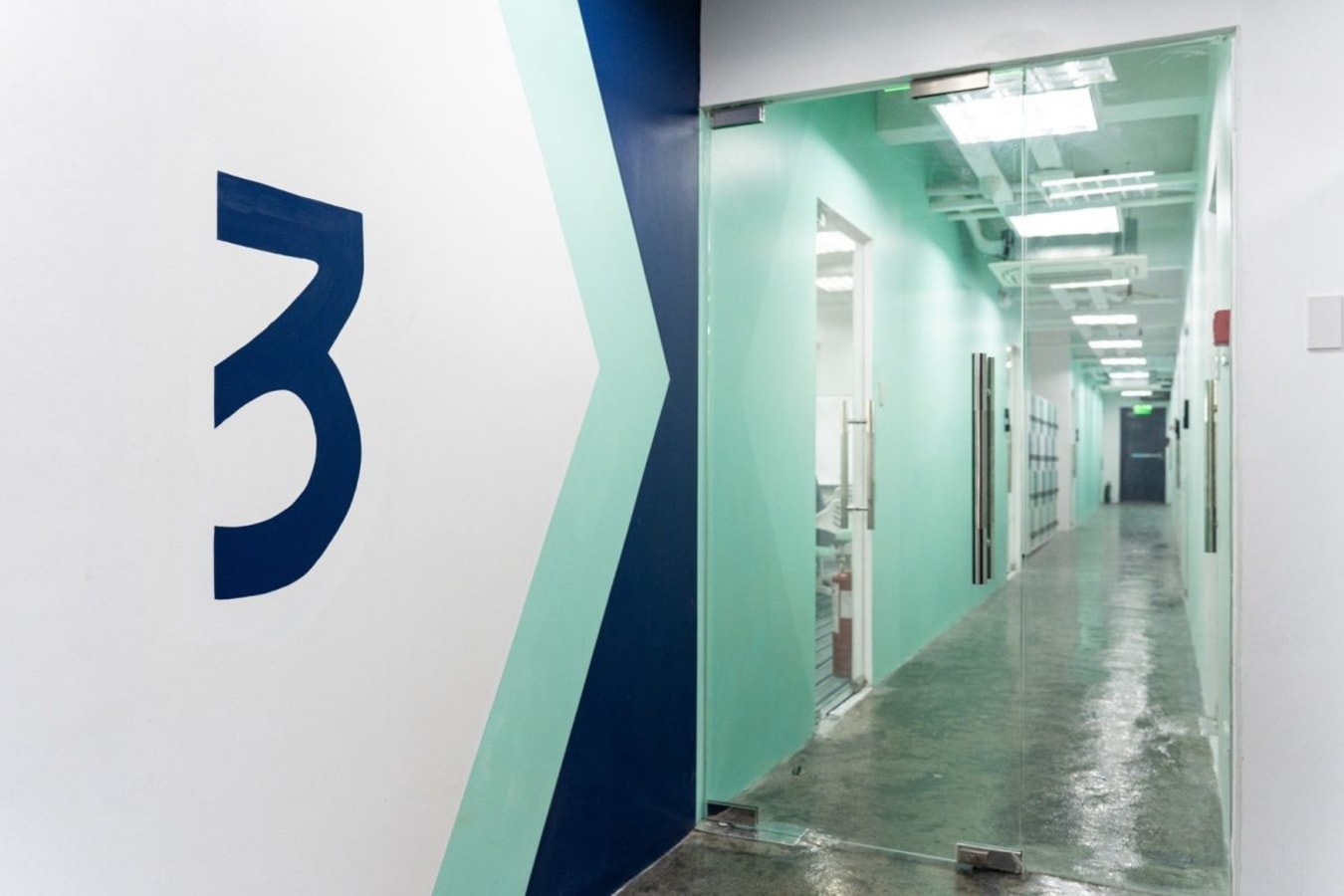 Sleek, modern coworking space with a vibrant, inviting corridor in Angel St, Central Luzon.