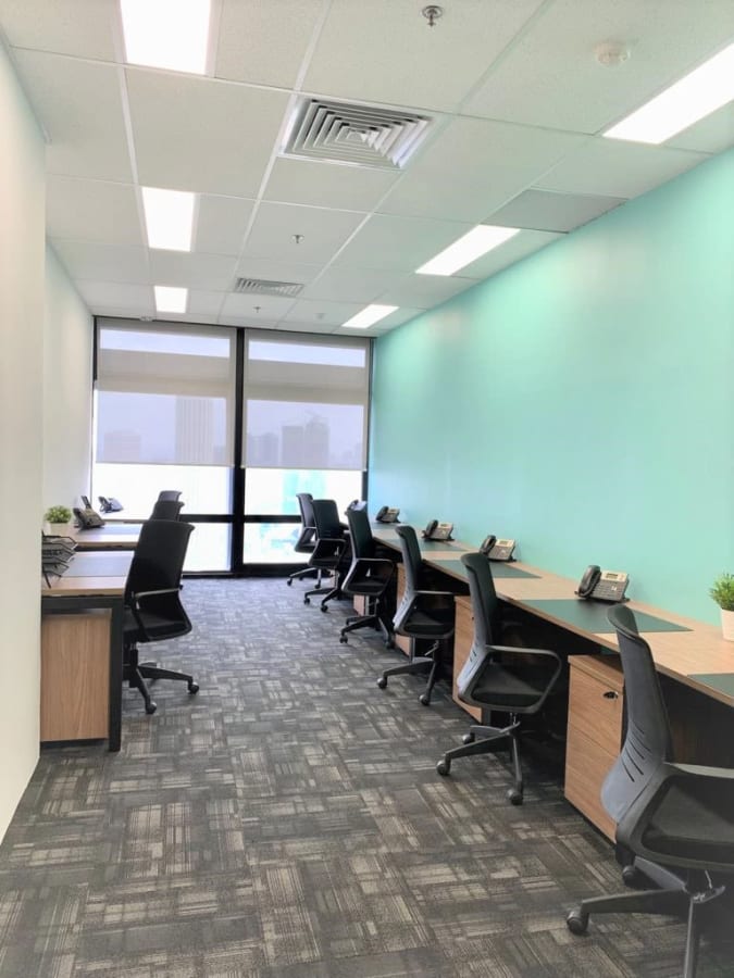 Bright, modern coworking space with ample seating and natural light in Singapore.