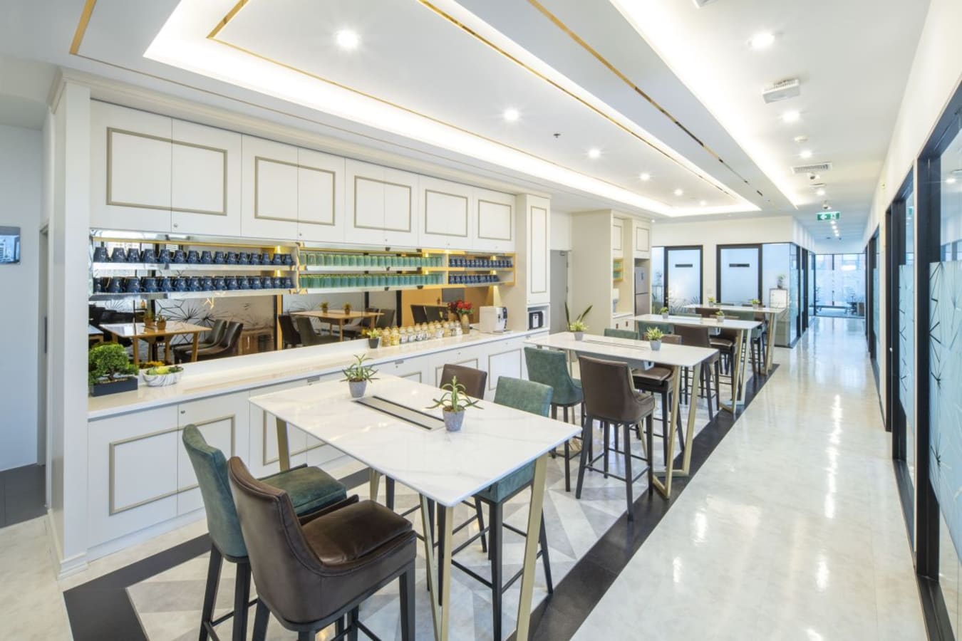 Modern coworking space with elegant seating, ample natural light, and a stylish communal area.