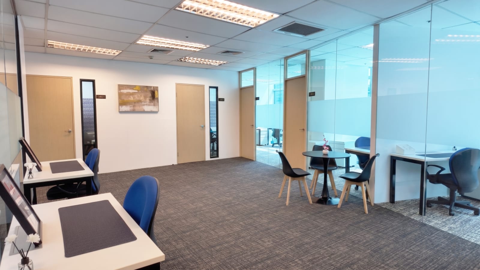 Modern coworking space with private offices, bright lighting, and sleek furnishings on Meralco Ave.
