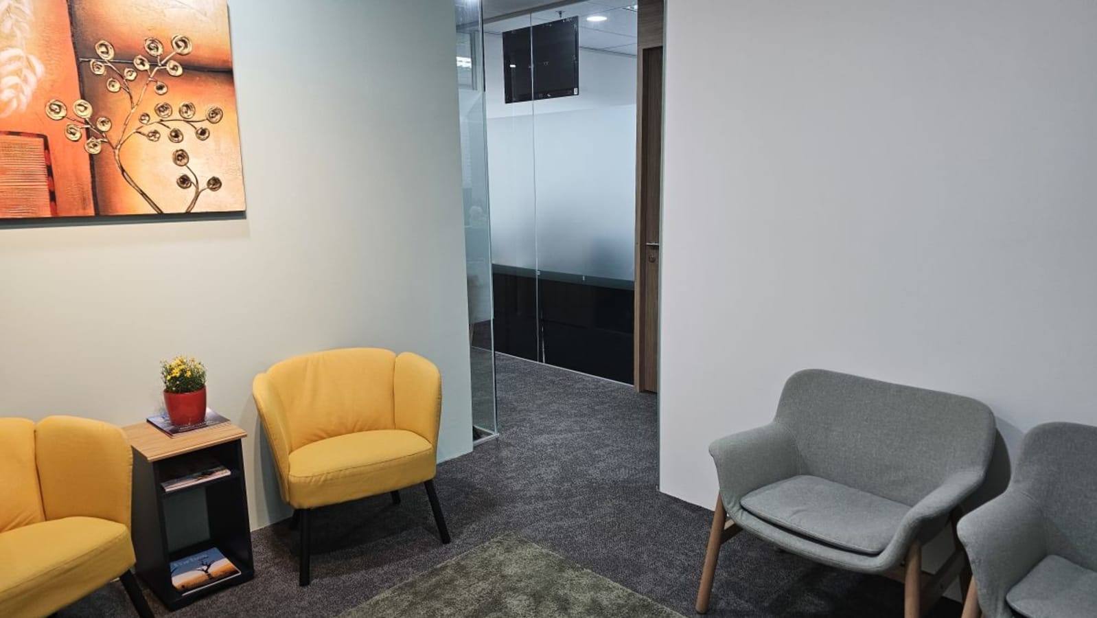 Inviting lounge area with vibrant seating and art, perfect for networking.