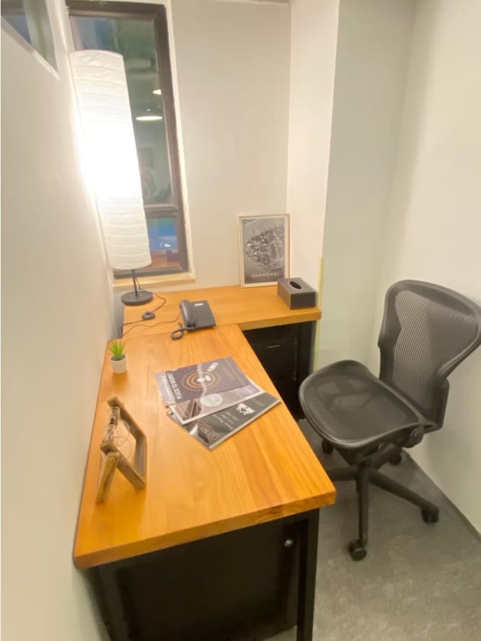 Cozy, private workspace with ergonomic chair and natural light on Hysan Avenue.