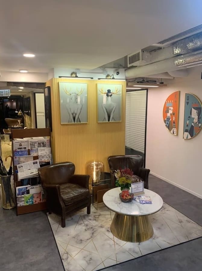 Cozy lounge with stylish decor in flexible coworking space on Hysan Avenue. Ideal for networking.