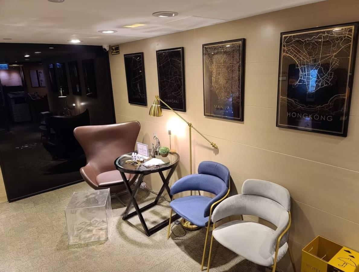 Cozy coworking nook with stylish seating and city map decor on Hysan Avenue. Perfect for meetings.