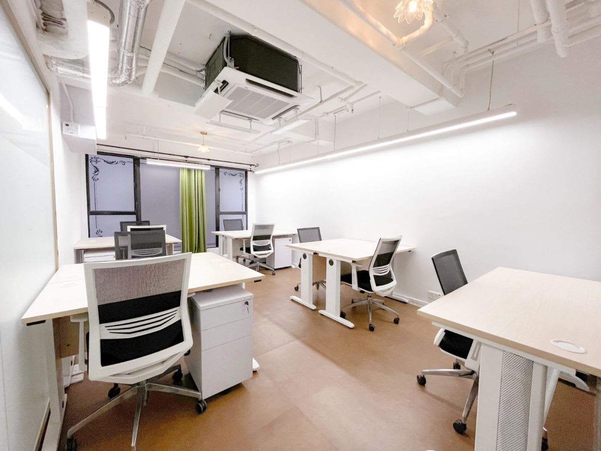Bright, modern coworking space with flexible seating and abundant natural light.