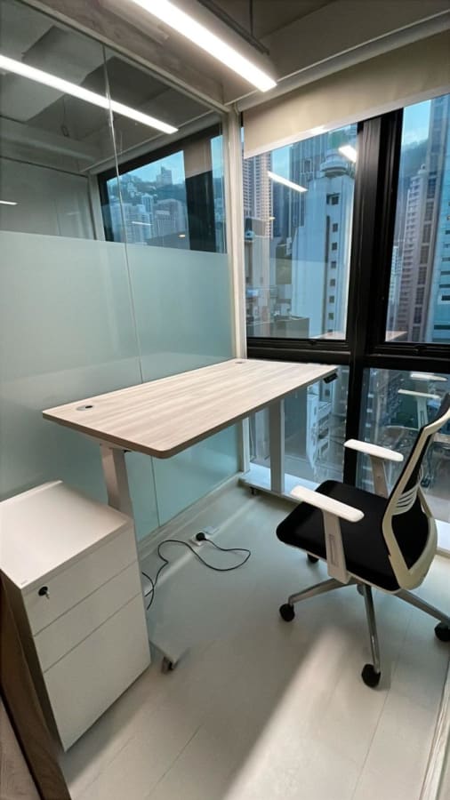 Compact private office with natural light and city views on Wellington Street, Hong Kong Island.