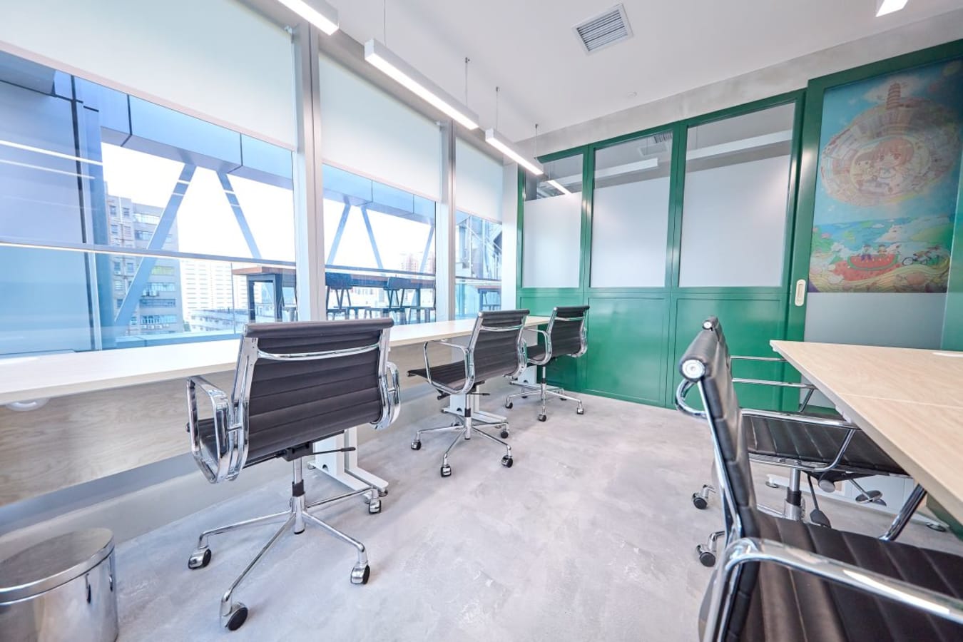 Modern coworking space with bright windows, sleek chairs, and vibrant decor. Perfect for collaboration.