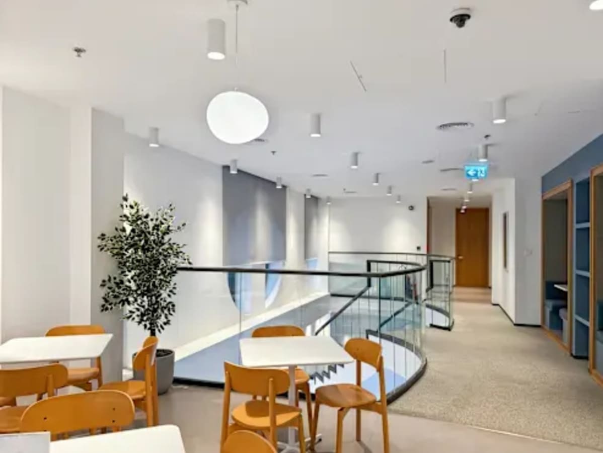 Bright, modern coworking space with open layout and stylish seating in Port Saeed Deira.