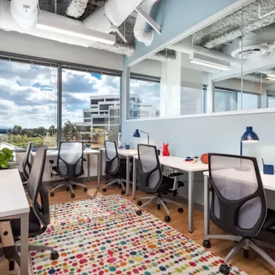 Bright, modern coworking space with vibrant decor and natural light in Dubai's 17th Street area.