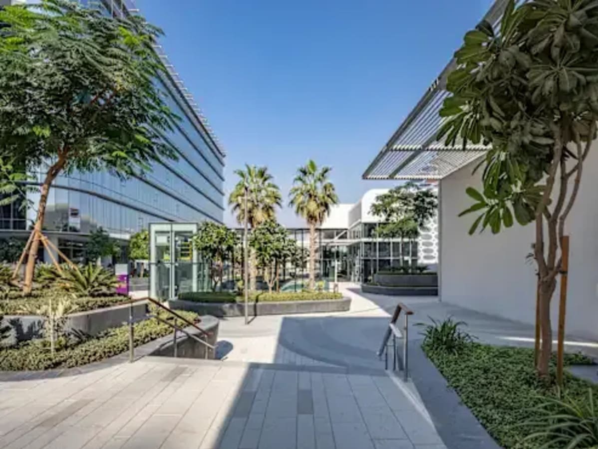 Lush outdoor courtyard at a vibrant coworking space on 17th Street, Dubai. Perfect for networking.
